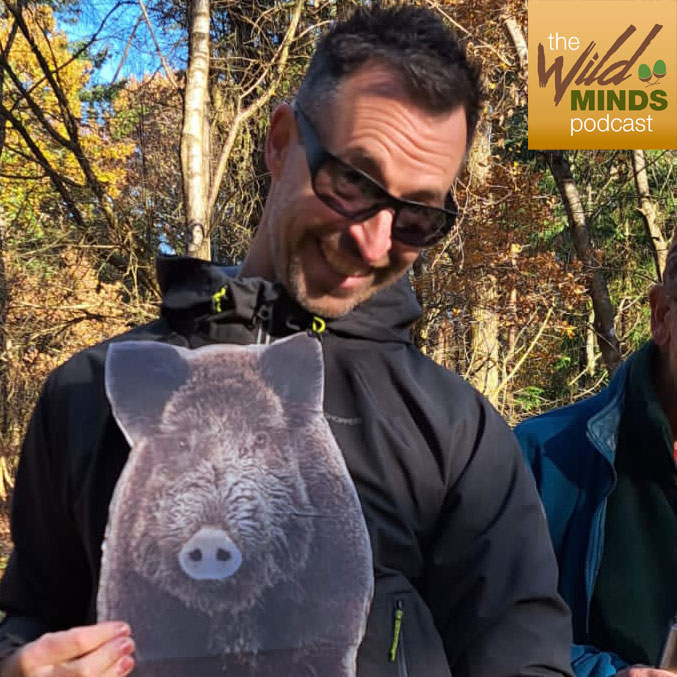 Dylan Walker holding image of a wild boar